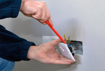 A person opening an house electric board